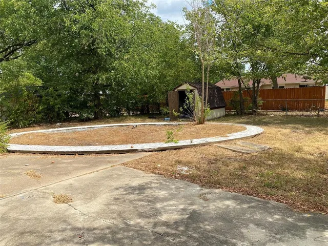 a view of a playground with basketball court