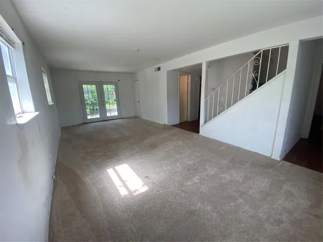 a view of empty room with windows