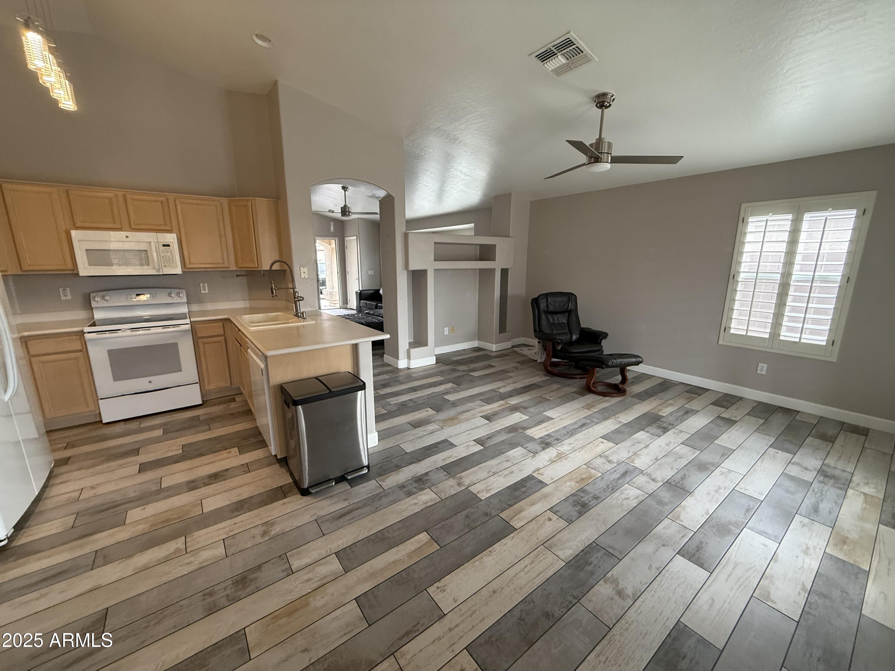 1736 North Seton Mesa, AZ 85205 - Photo 13 of 26 a kitchen with a sink appliances and cabinets