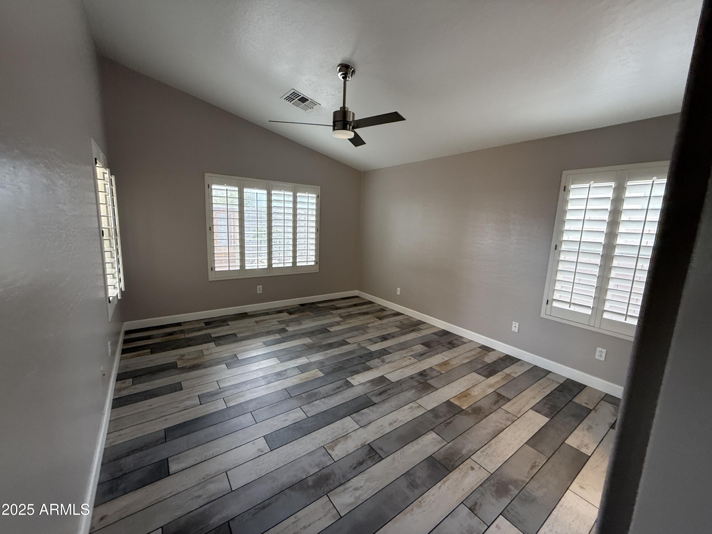 1736 North Seton Mesa, AZ 85205 - Photo 15 of 26 a view of empty room with wooden floor and fan