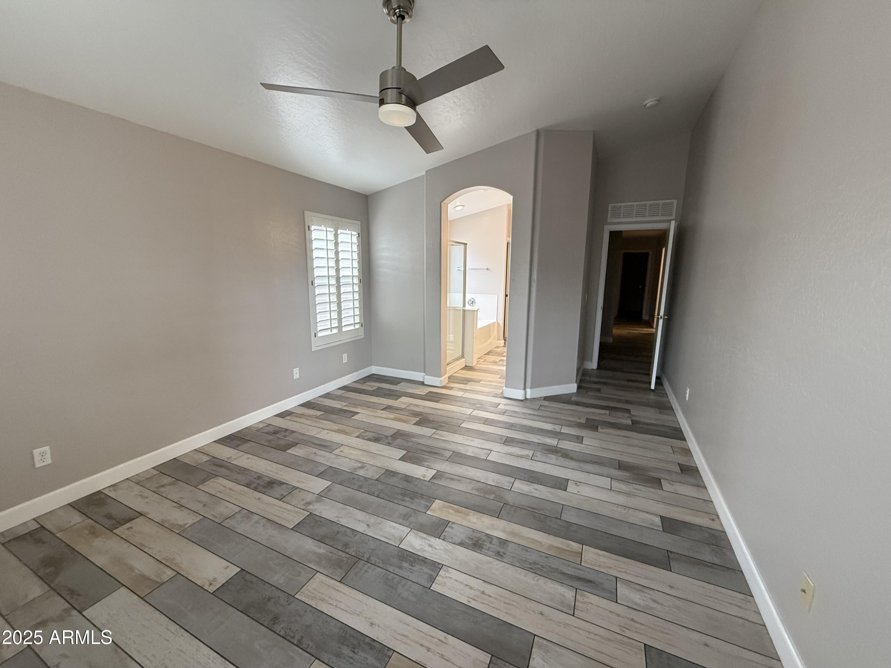 1736 North Seton Mesa, AZ 85205 - Photo 16 of 26 wooden floor in an empty room with a window