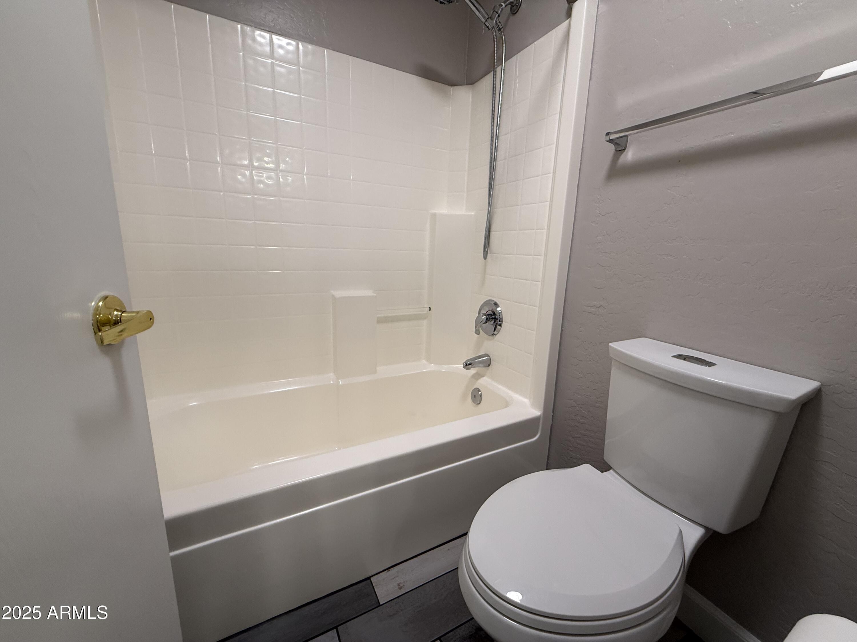 1736 North Seton Mesa, AZ 85205 - Photo 21 of 26 a white toilet and tub next to a bathroom sink