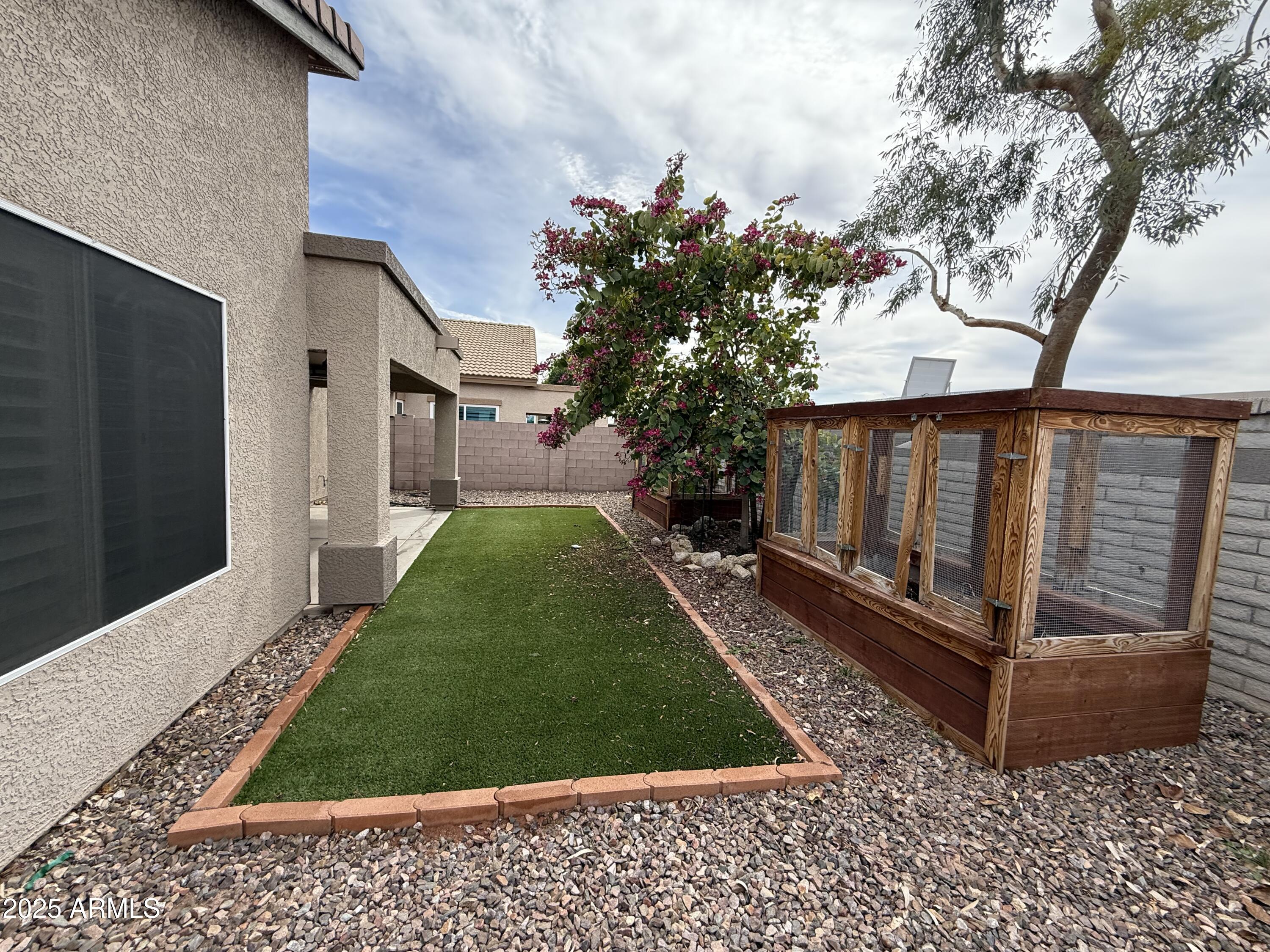 1736 North Seton Mesa, AZ 85205 - Photo 24 of 26 a view of a backyard with a garden