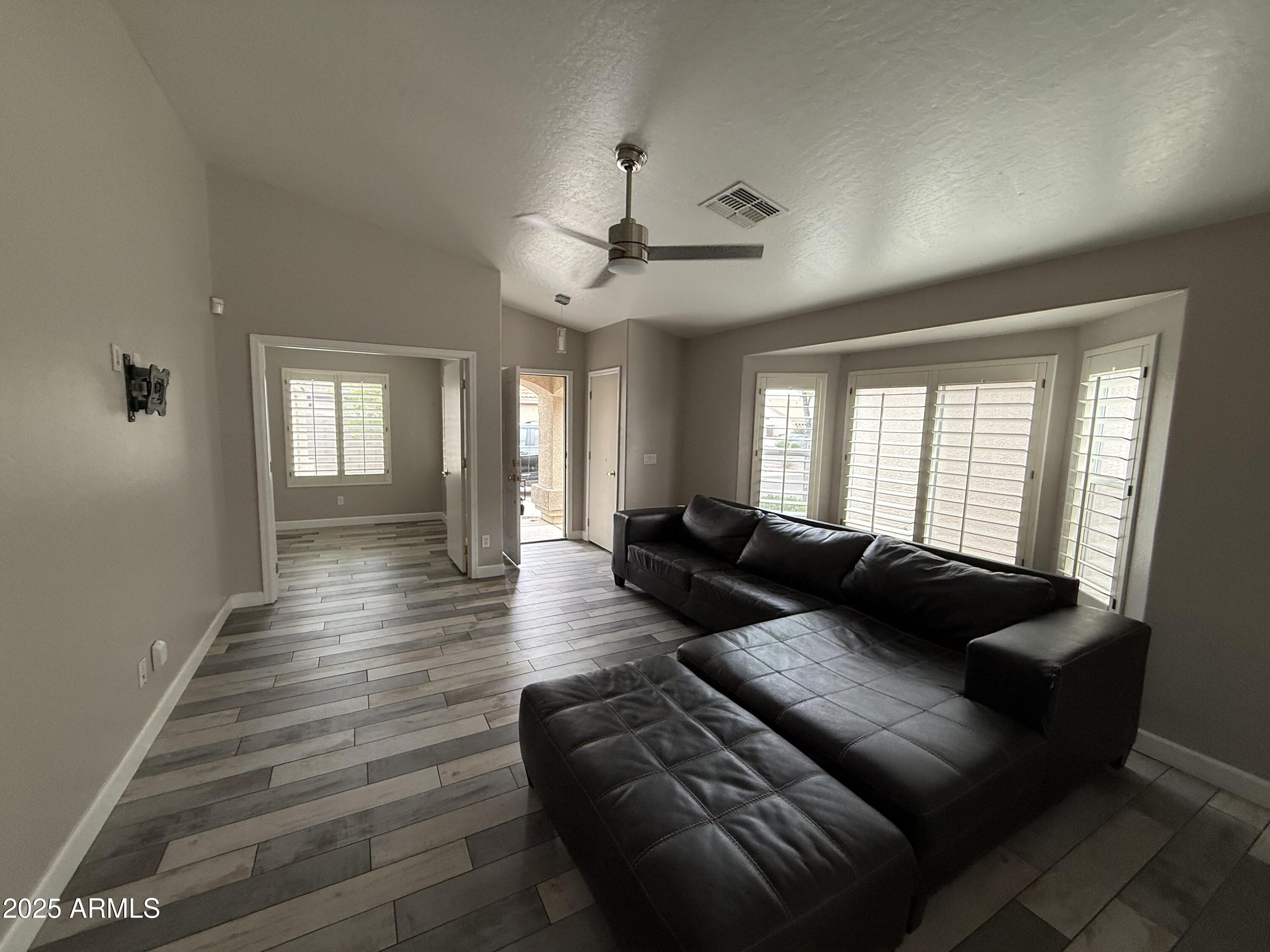 1736 North Seton Mesa, AZ 85205 - Photo 3 of 26 a living room with furniture and a chandelier