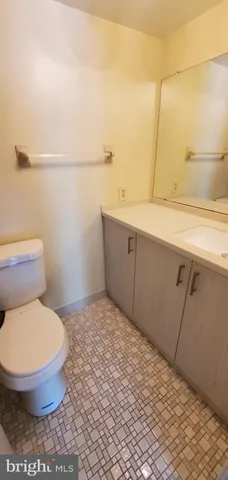 a bathroom with a toilet and a sink