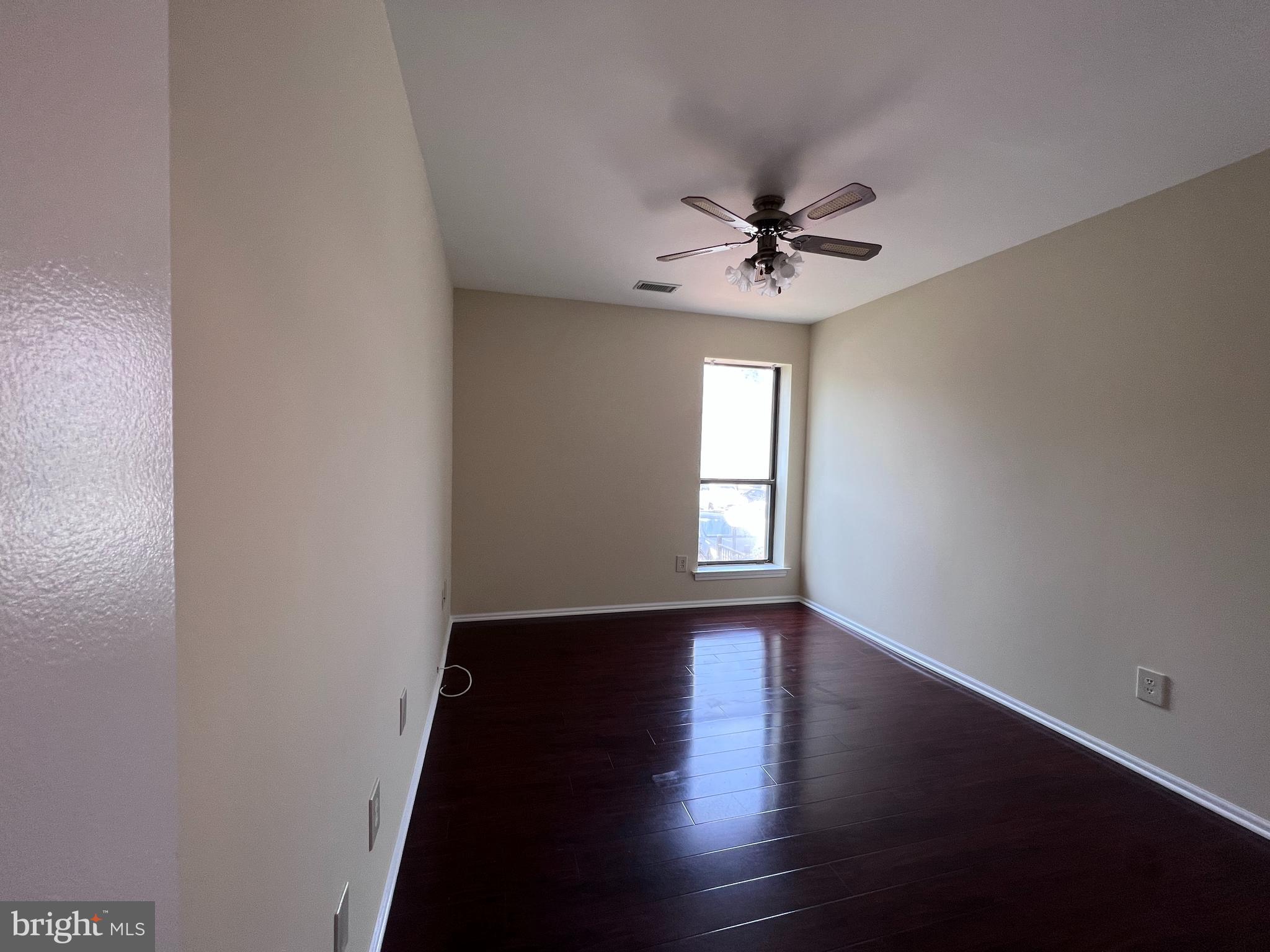301 Byberry Road, Unit E8 Philadelphia, PA 19116 - Photo 13 of 44 wooden floor in an empty room with a window