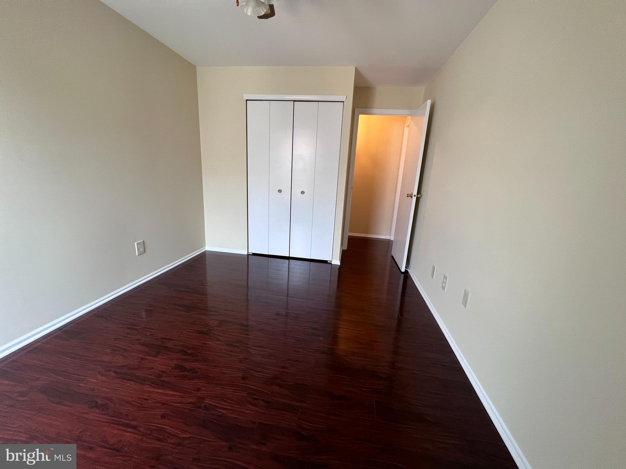 301 Byberry Road, Unit E8 Philadelphia, PA 19116 - Photo 21 of 44 an empty room with wooden floor and window