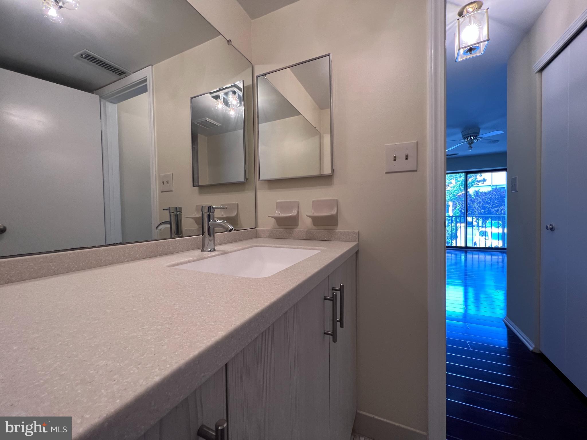 301 Byberry Road, Unit E8 Philadelphia, PA 19116 - Photo 29 of 44 a bathroom with a sink and a mirror