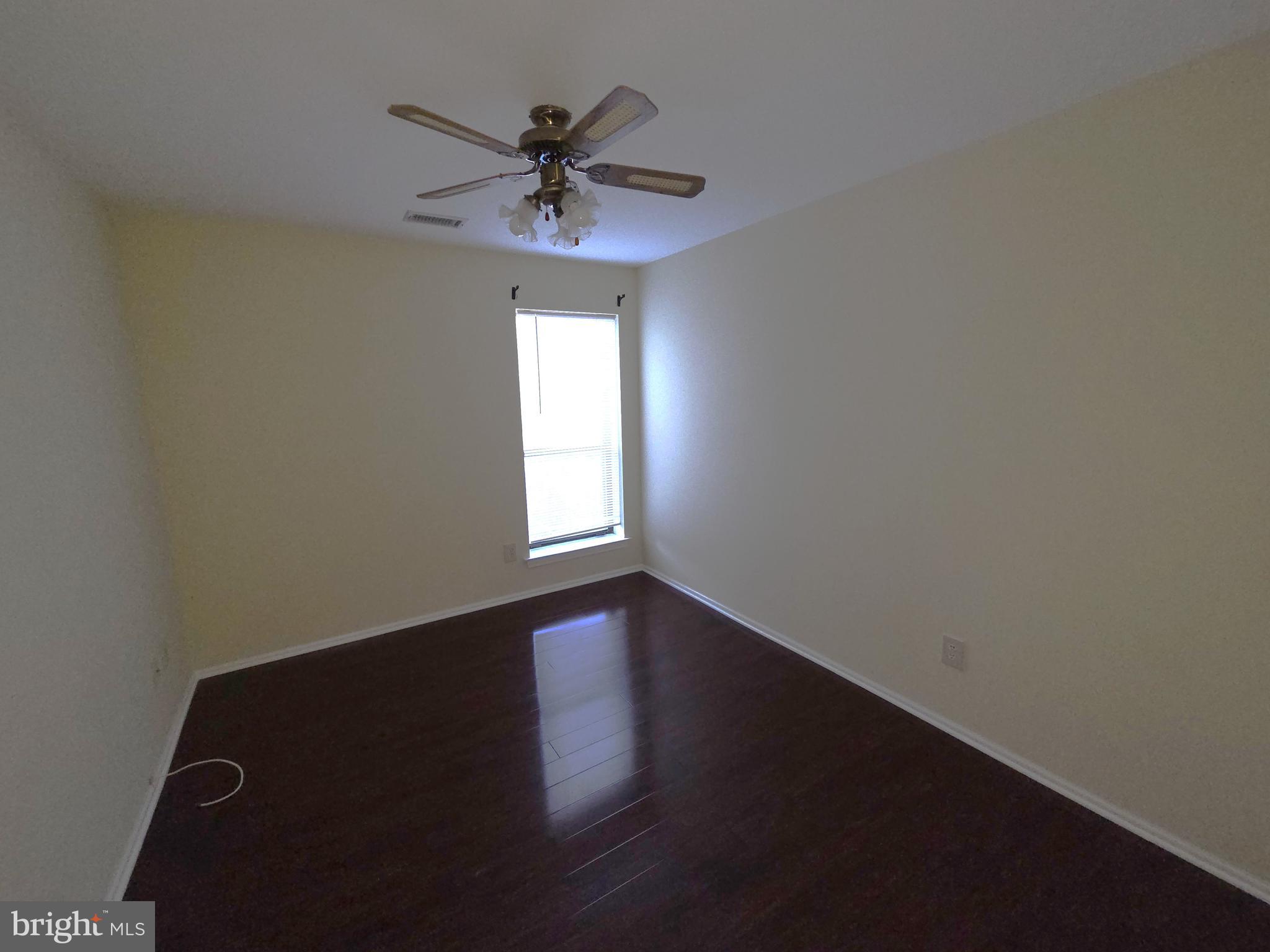 301 Byberry Road, Unit E8 Philadelphia, PA 19116 - Photo 35 of 44 a view of an empty room with wooden floor and a window