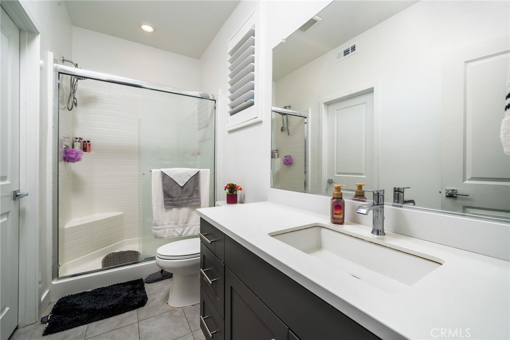 2414 Crater Avenue Rialto, CA 92377 - Photo 17 of 50 a bathroom with a sink and a mirror