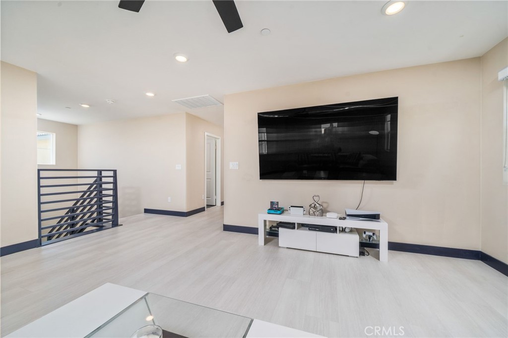 2414 Crater Avenue Rialto, CA 92377 - Photo 18 of 50 a living room with furniture and a flat screen tv