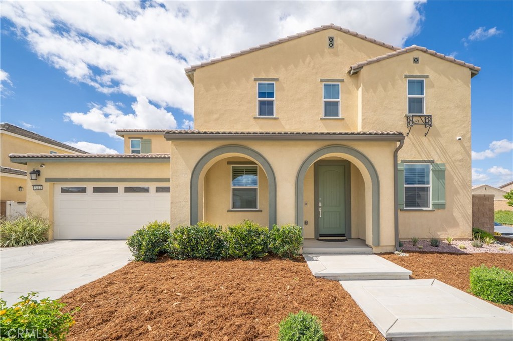 2414 Crater Avenue Rialto, CA 92377 - Photo 2 of 50 a front view of a house with a yard