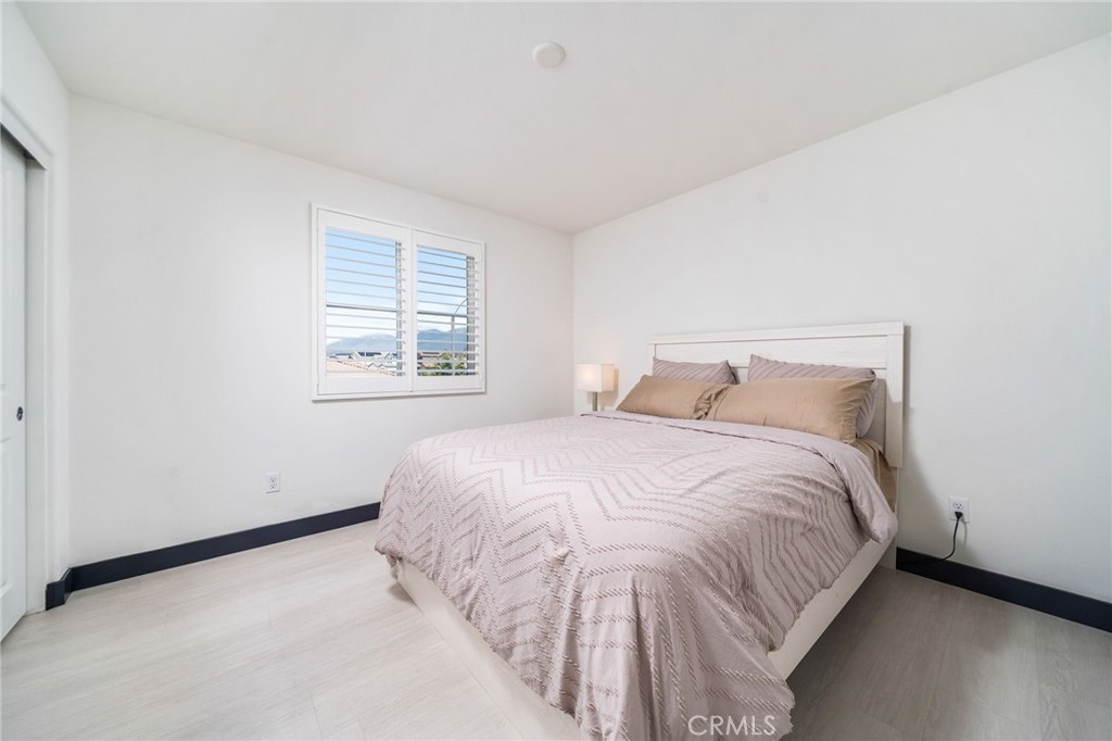 2414 Crater Avenue Rialto, CA 92377 - Photo 22 of 50 a bedroom with a bed and a window