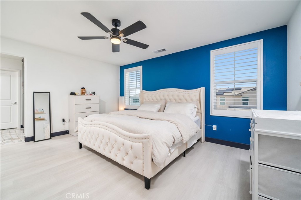 2414 Crater Avenue Rialto, CA 92377 - Photo 25 of 50 a bedroom with a bed and a ceiling fan