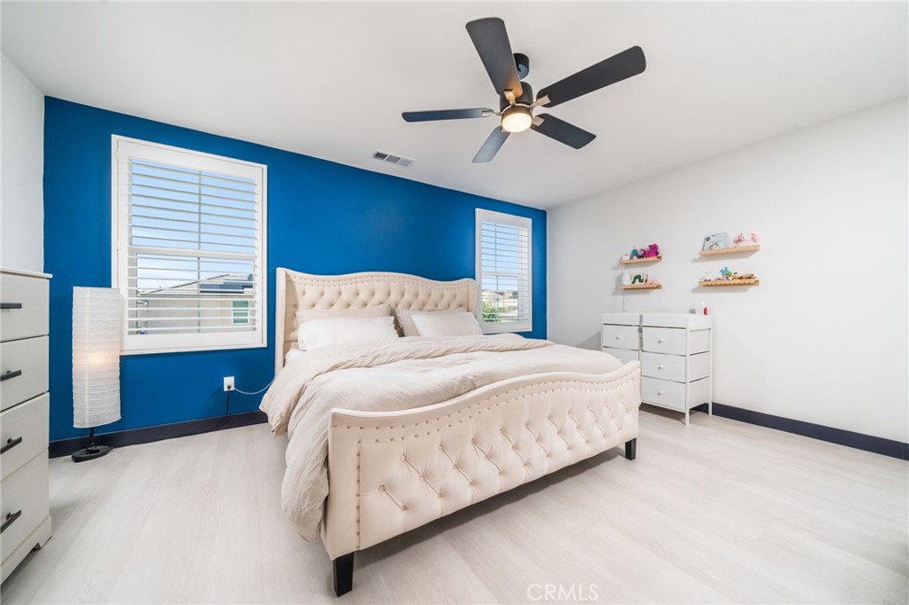 2414 Crater Avenue Rialto, CA 92377 - Photo 26 of 50 a bedroom with a bed and a chandelier