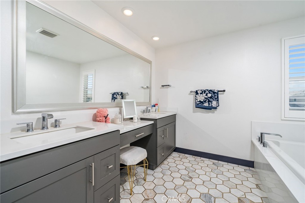 2414 Crater Avenue Rialto, CA 92377 - Photo 28 of 50 a bathroom with a sink a toilet and mirror