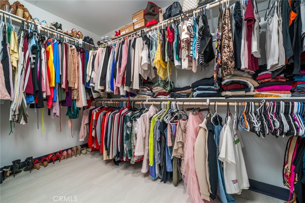 2414 Crater Avenue Rialto, CA 92377 - Photo 29 of 50 a view of walk in closet with clothes