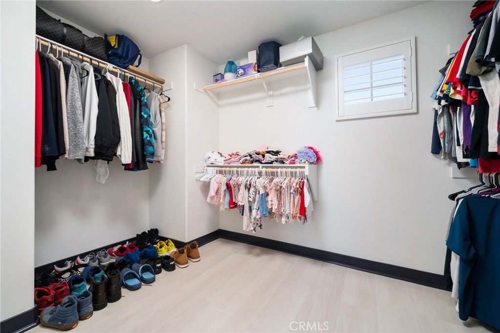 2414 Crater Avenue Rialto, CA 92377 - Photo 30 of 50 a view of walk in closet with clothes and shoes