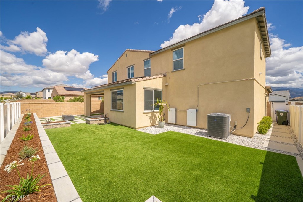 2414 Crater Avenue Rialto, CA 92377 - Photo 36 of 50 a view of a house with a yard