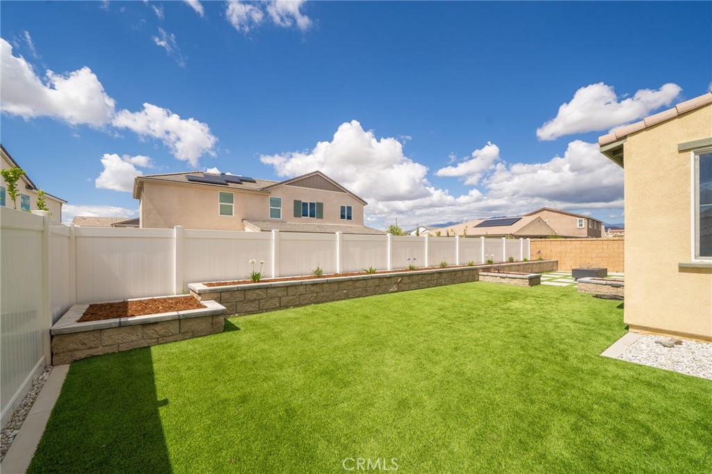2414 Crater Avenue Rialto, CA 92377 - Photo 37 of 50 a front view of a house with a yard