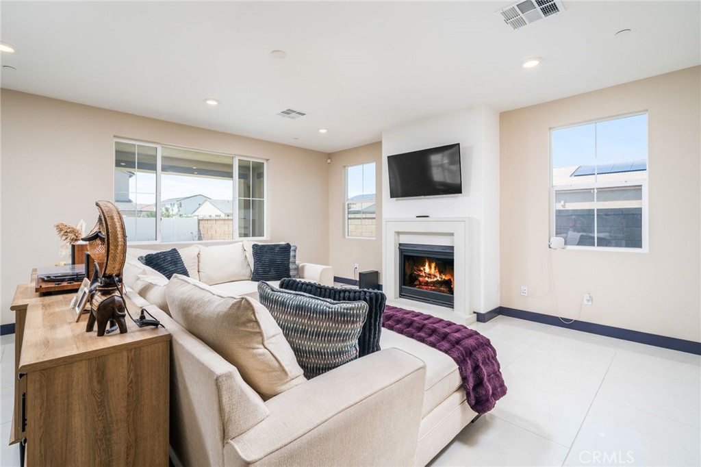 2414 Crater Avenue Rialto, CA 92377 - Photo 7 of 50 a living room with furniture and a fireplace