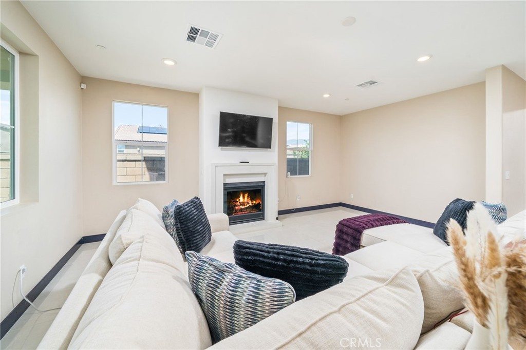 2414 Crater Avenue Rialto, CA 92377 - Photo 8 of 50 a bedroom with a bed and a couch