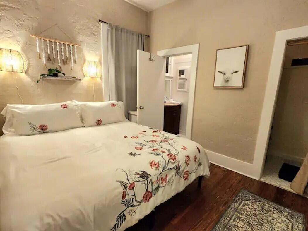 711 South N Street, Unit 1 Lake Worth Beach, FL 33460 - Photo 5 of 12 a bedroom with a bed and wooden floor