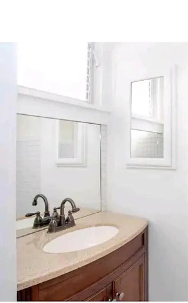 711 South N Street, Unit 1 Lake Worth Beach, FL 33460 - Photo 10 of 12 a bathroom with a sink and a mirror