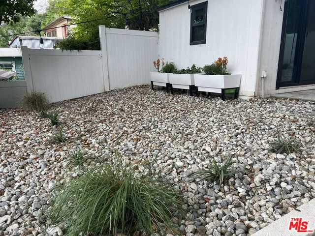 a view of a backyard with a garden