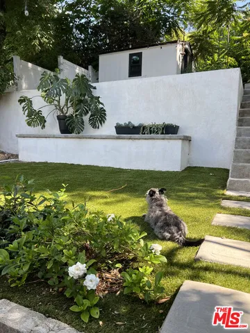 a view of swimming pool with a yard