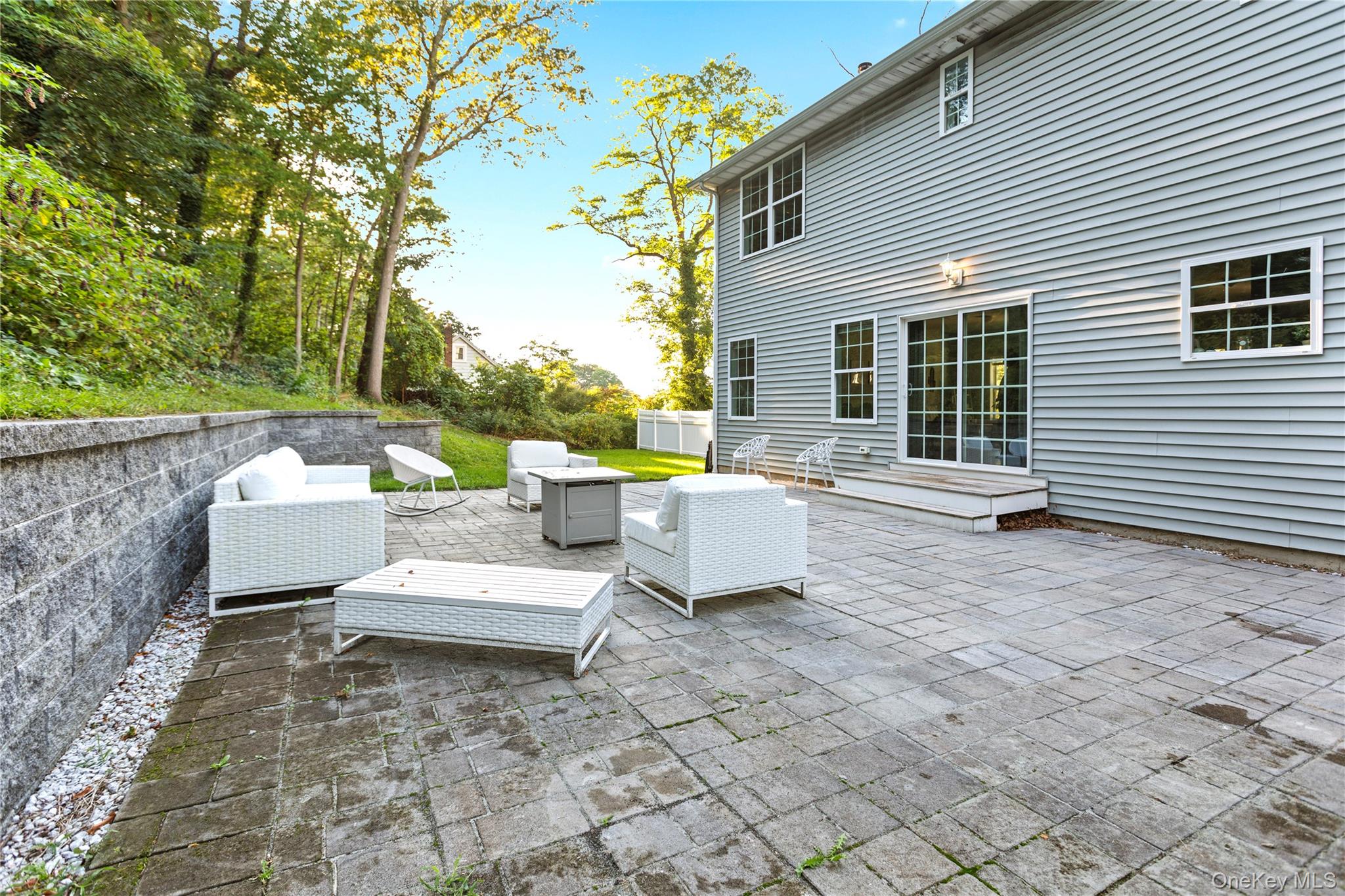 24 Belmont Road Sound Beach, NY 11789 - Photo 22 of 23 a view of a patio with a table and chairs and couches