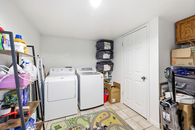 1662 East Ridgefield Road Spanish Fork, UT 84660 - Photo 16 of 18 Dedicated laundry area featuring white appliances, tile flooring, and a solid-core door