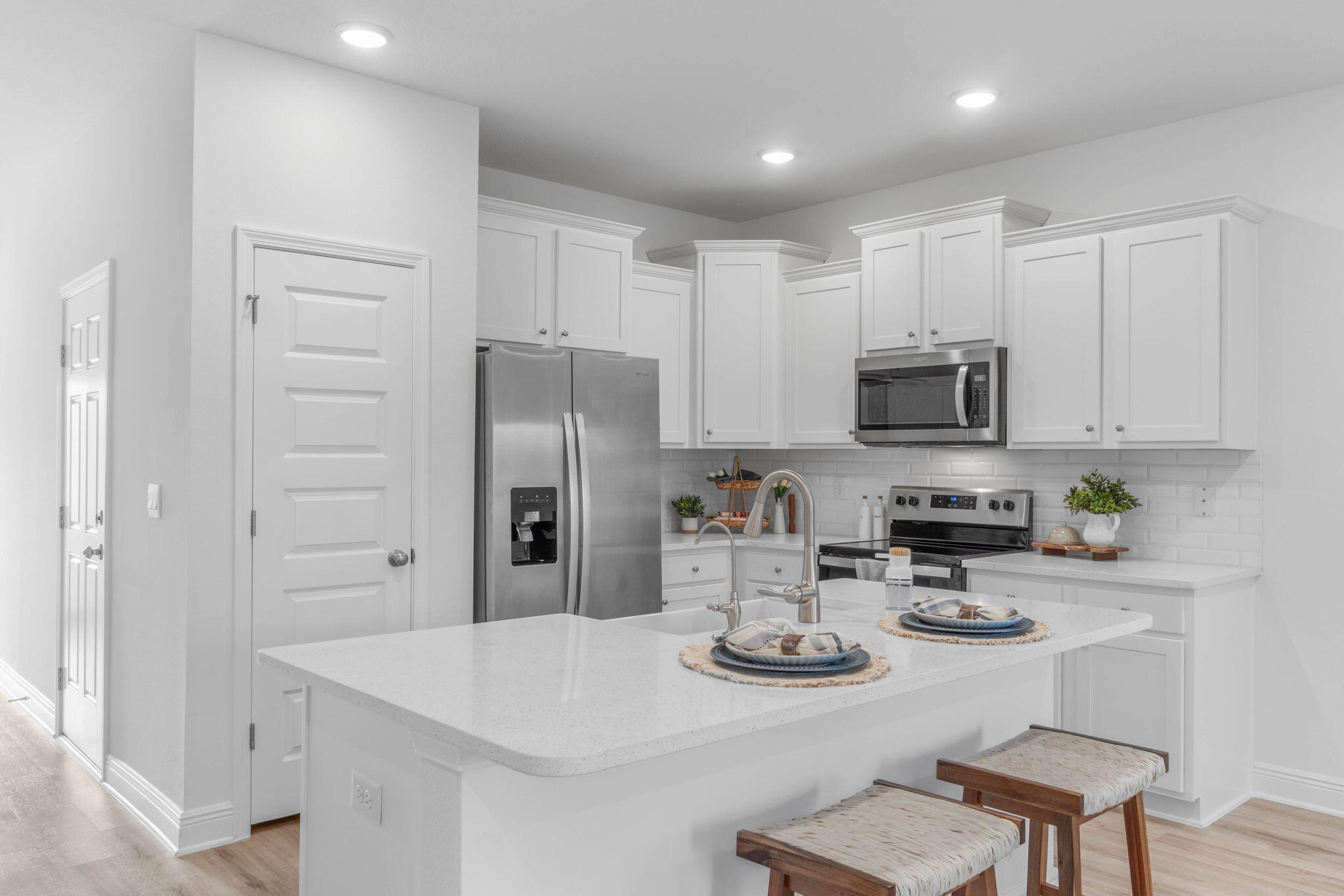 1 Renea Cove Destin, FL 32541 - Photo 12 of 51 a kitchen with stainless steel appliances kitchen island granite countertop a refrigerator a stove a sink and white cabinets with wooden floor