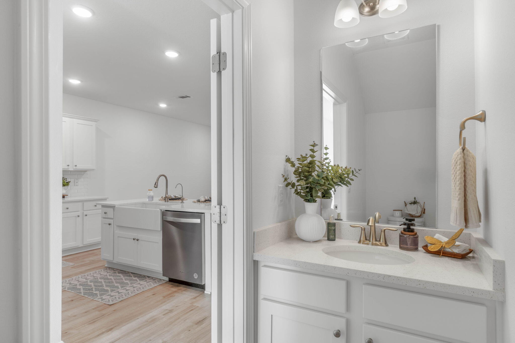 1 Renea Cove Destin, FL 32541 - Photo 23 of 51 a bathroom with a sink a faucet a potted plant and a mirror