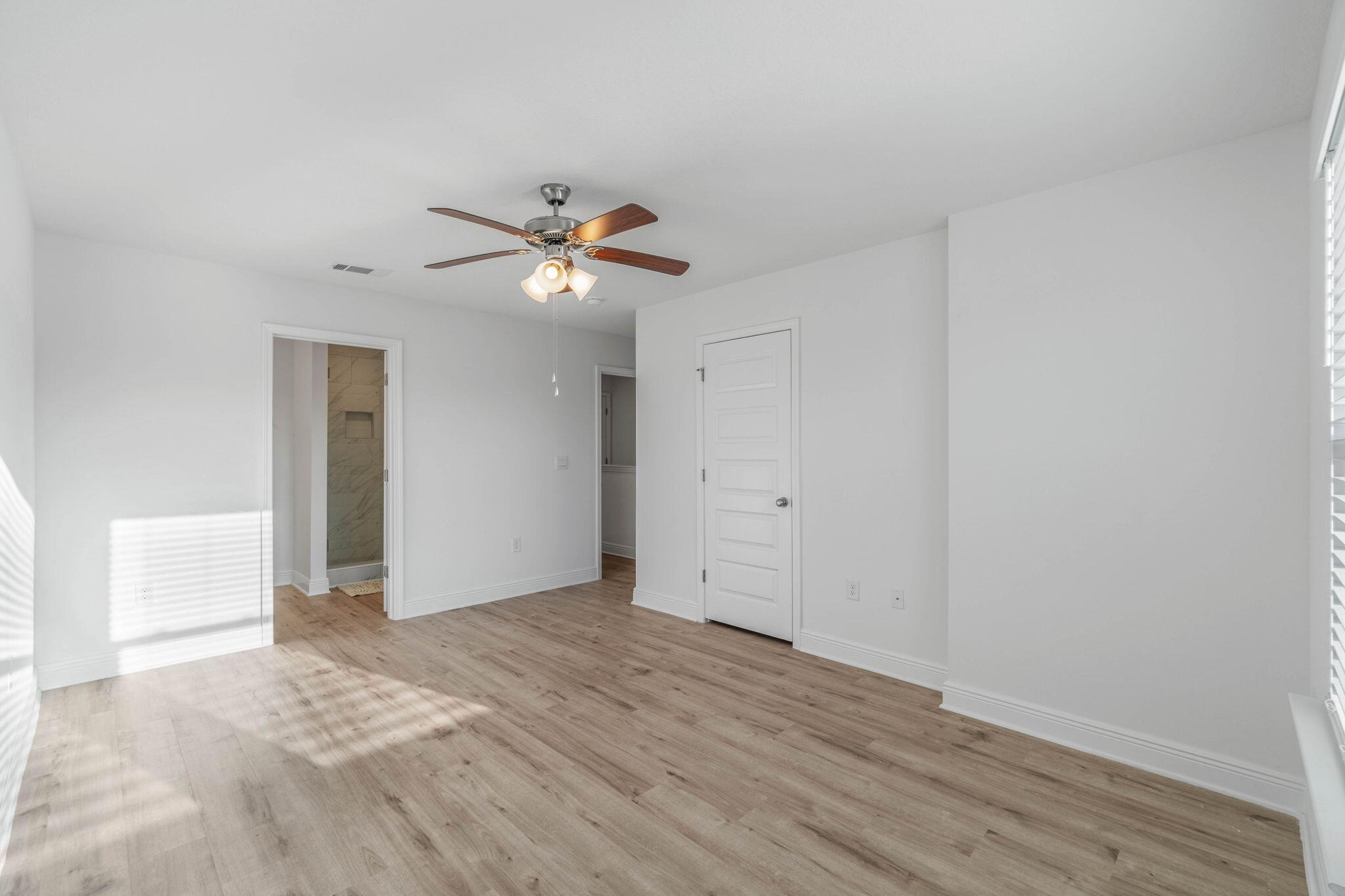 1 Renea Cove Destin, FL 32541 - Photo 29 of 51 a view of a big room with wooden floor and a ceiling fan