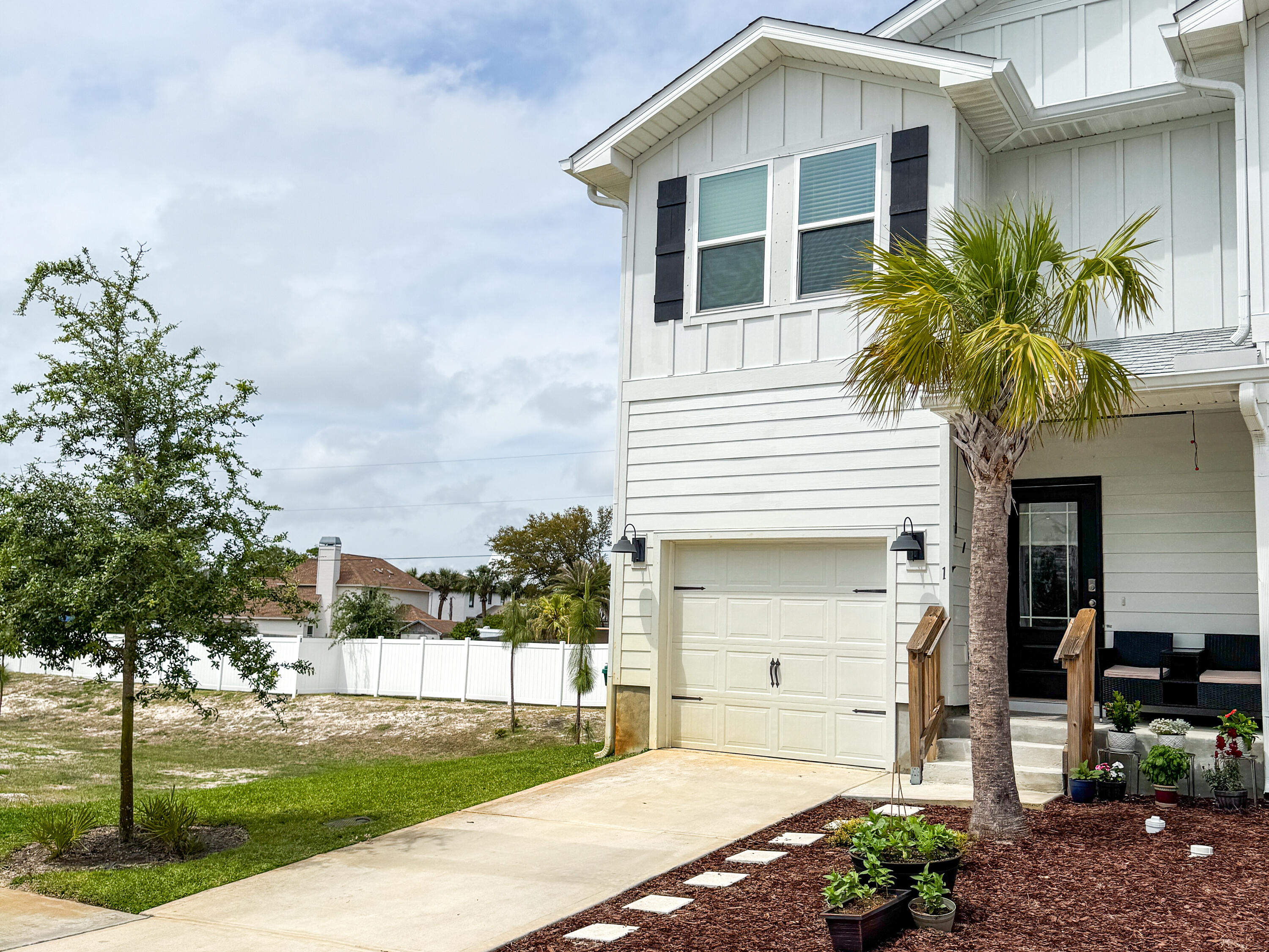 1 Renea Cove Destin, FL 32541 - Photo 6 of 51 a front view of a house with a garden