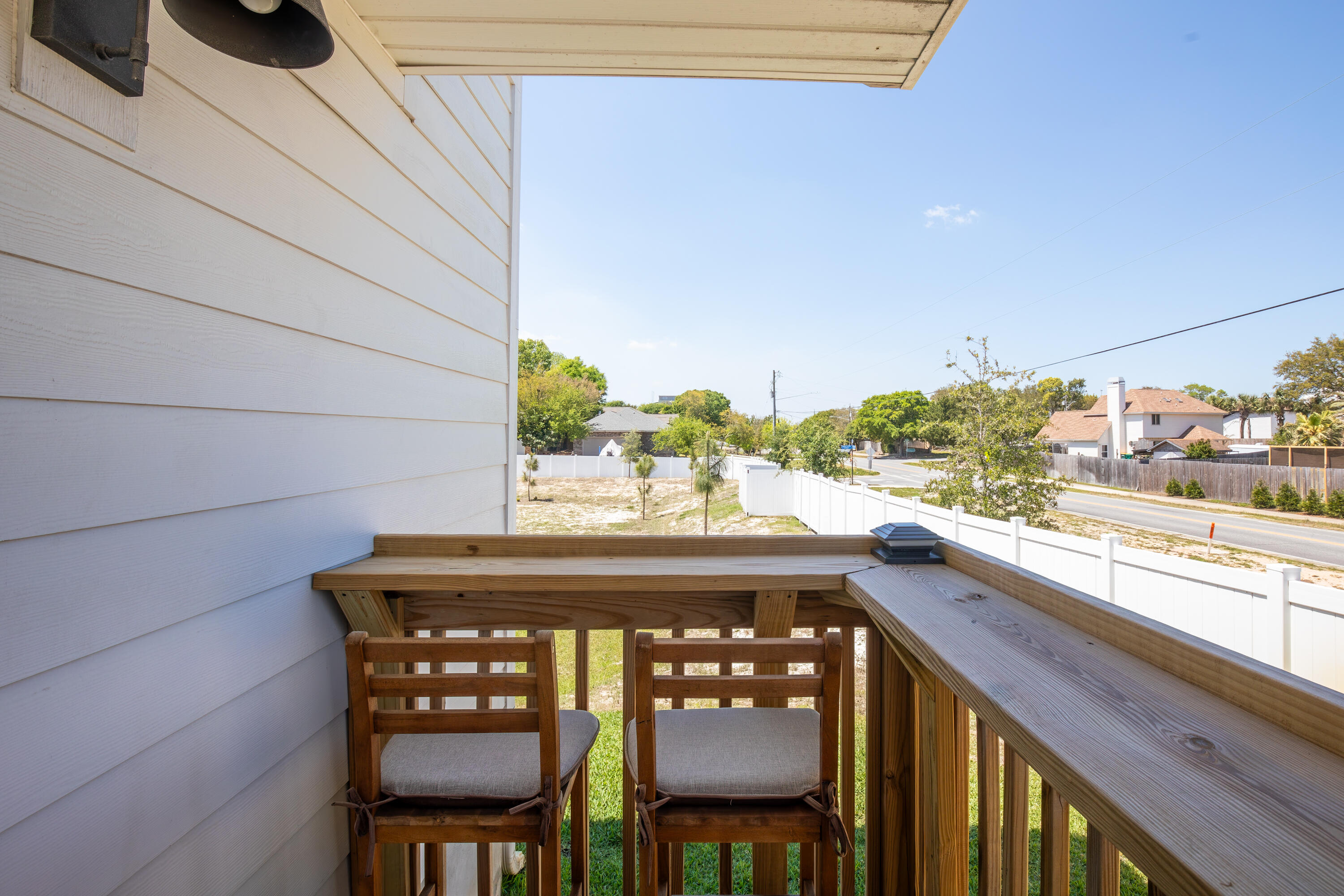 1 Renea Cove Destin, FL 32541 - Photo 7 of 51 a view of a chairs and table in a balcony
