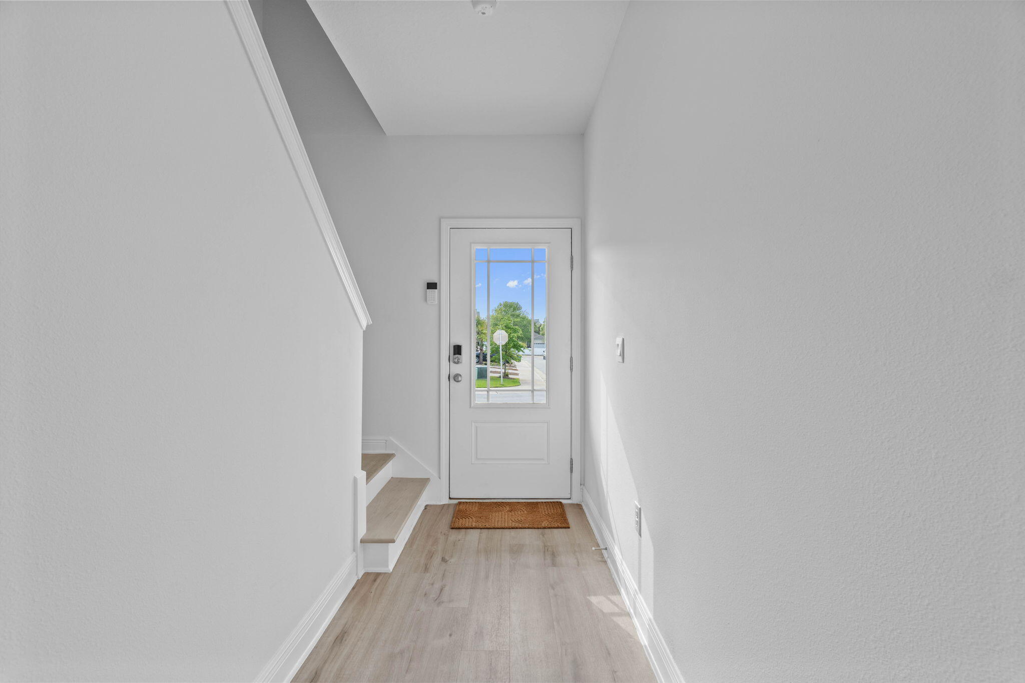 1 Renea Cove Destin, FL 32541 - Photo 9 of 51 a view of a hallway with wooden floor and a bathroom