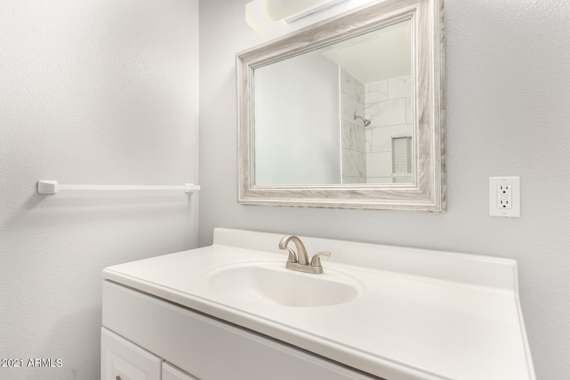 803 West Elna Rae Street Tempe, AZ 85281 - Photo 14 of 28 a bathroom with a sink and a mirror