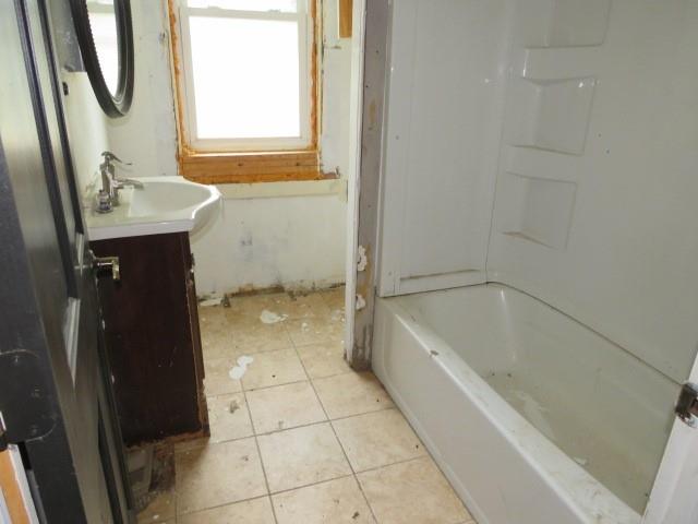 6 Morgan Street Cuddy, PA 15031 - Photo 15 of 34 a bathroom with a bathtub and a sink