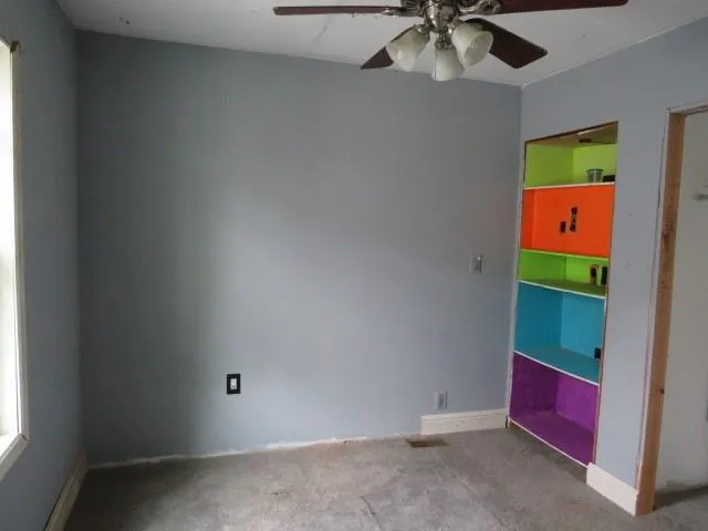 a view of a small house in the backyard