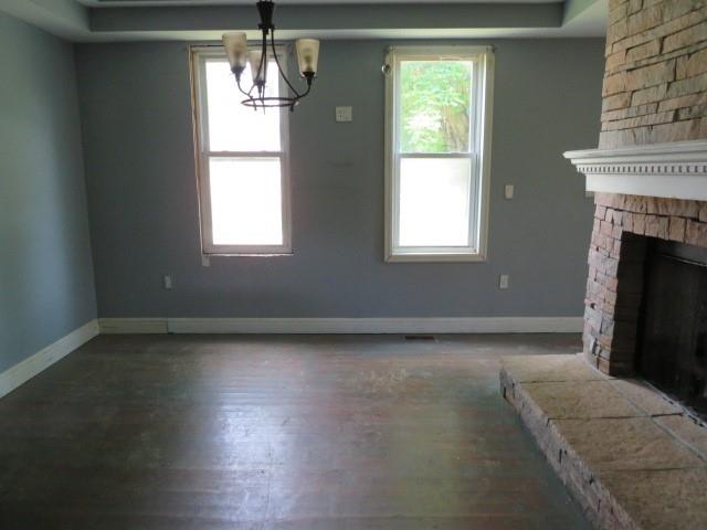 6 Morgan Street Cuddy, PA 15031 - Photo 6 of 34 a view of an empty room with wooden floor and a window