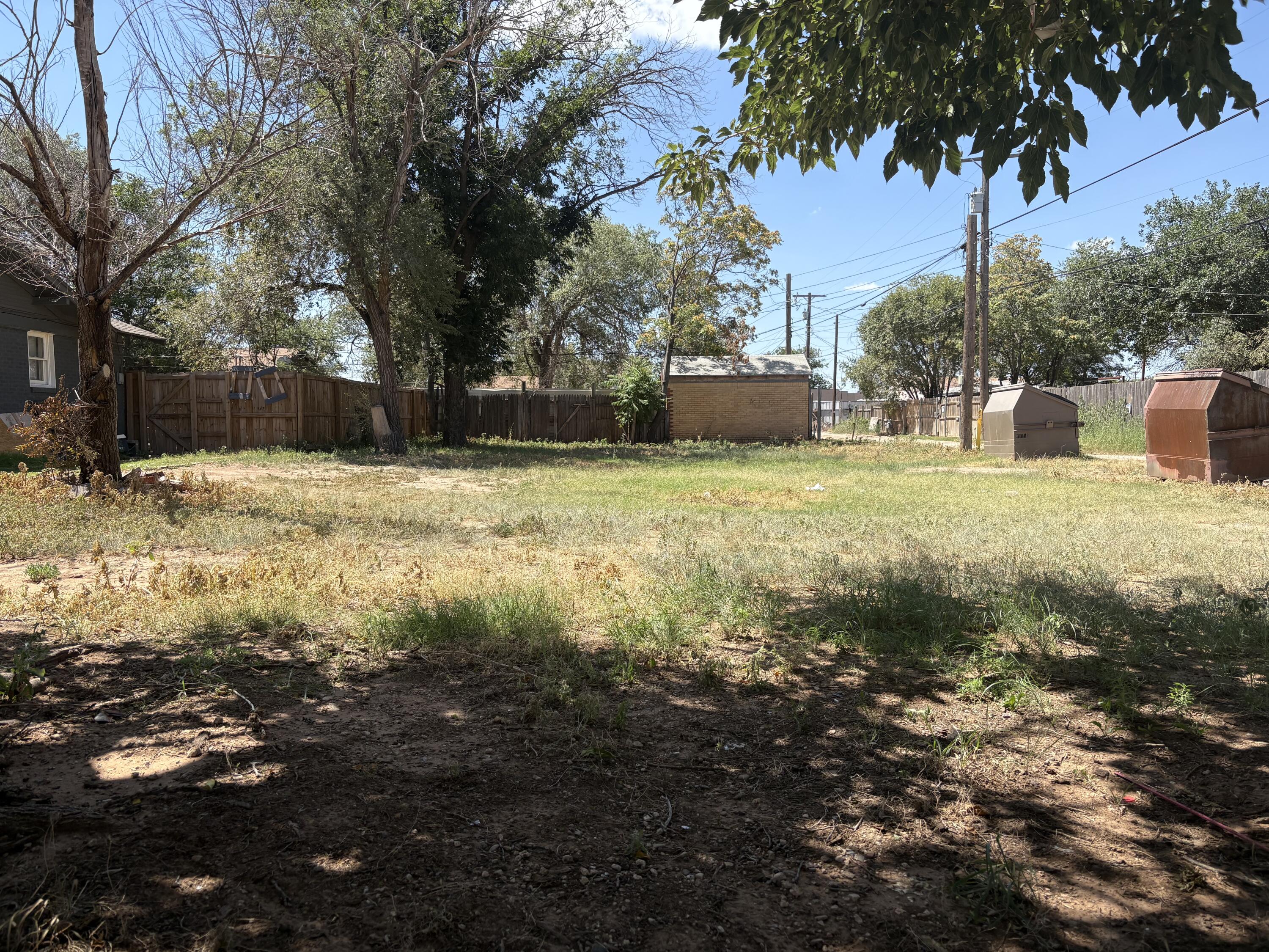 1805 18th Street Lubbock, TX 79401 - Photo 2 of 2 a view of a yard with large trees