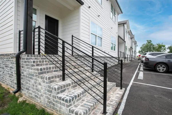 a living room with furniture and a walk in closet