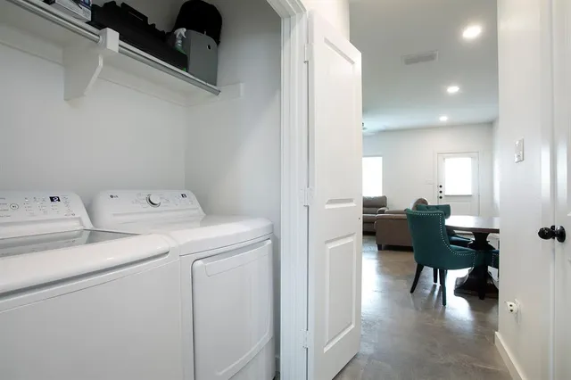 a kitchen with stainless steel appliances a refrigerator stove microwave and cabinets