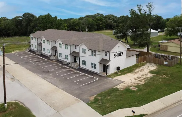 a aerial view of a house next to a lake view