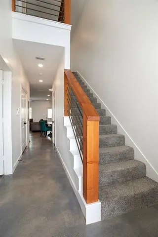 a view of a hallway with seating area