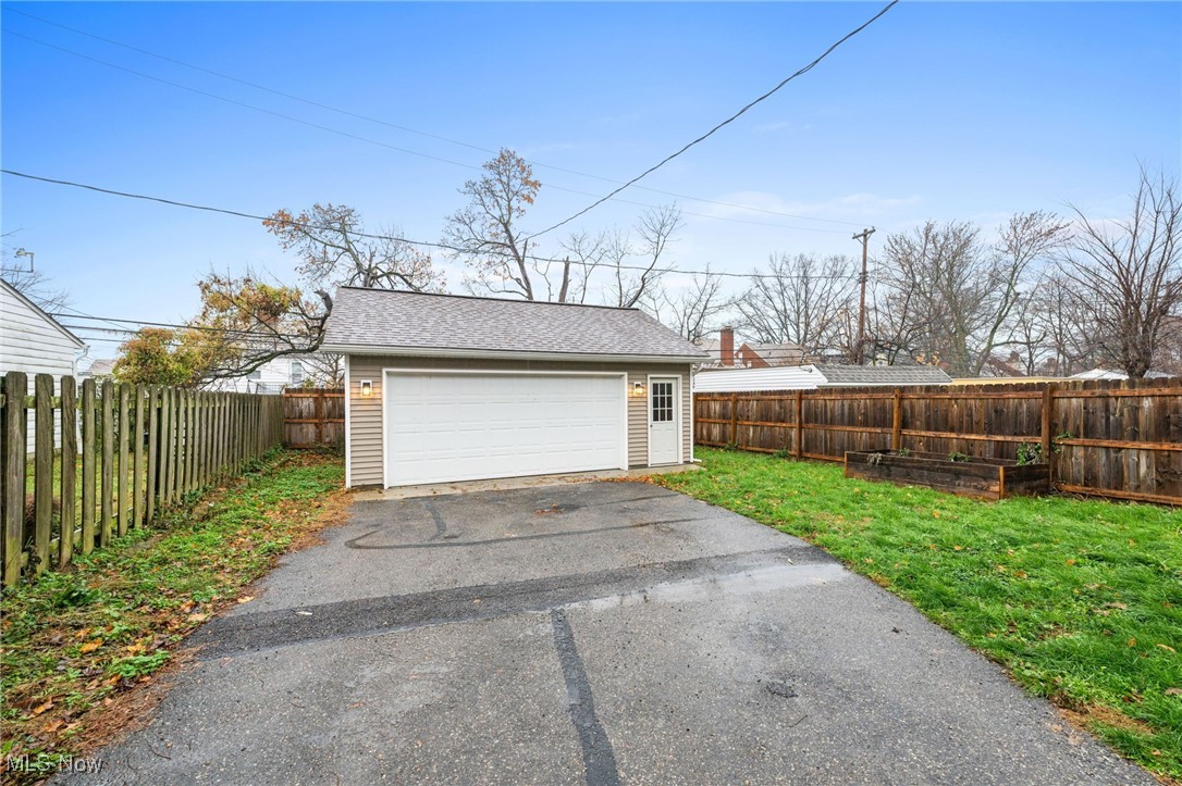3662 Riedham Road Cleveland, OH 44120 - Photo 25 of 30 Garage featuring a lawn
