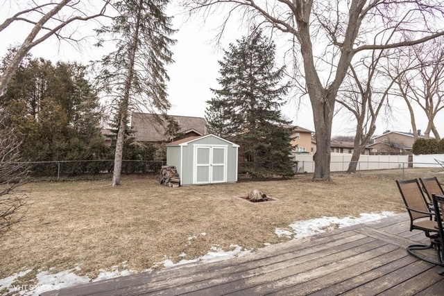 236 Kingsbridge Road Elk Grove Village, IL 60007 - Photo 13 of 13 a view of a house with a yard