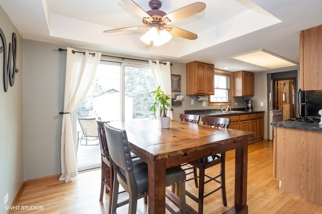 236 Kingsbridge Road Elk Grove Village, IL 60007 - Photo 5 of 13 a view of a dining room with furniture and a chandelier
